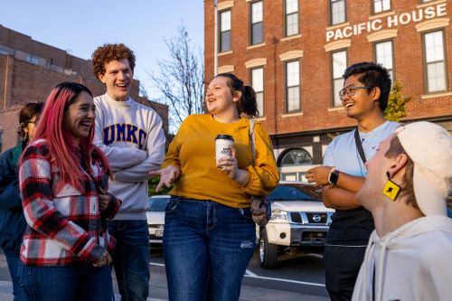 Group of students enjoy coffee and company downtown Kansas City