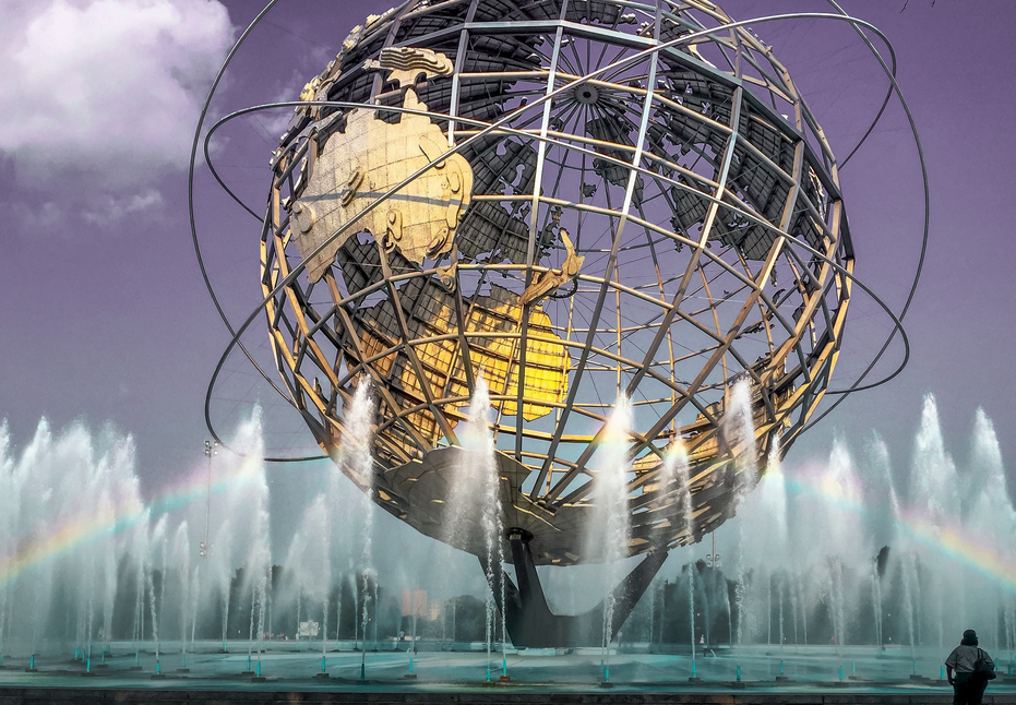 a water fountain featuring a large globe with a rainbow going through the center