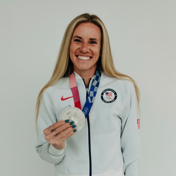 Olympic athlete Courtney Frerichs poses with her Olympic silver medal