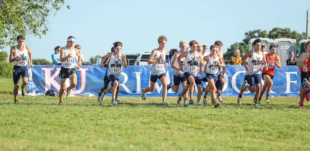 KC Roos women's cross country run a course in a pack