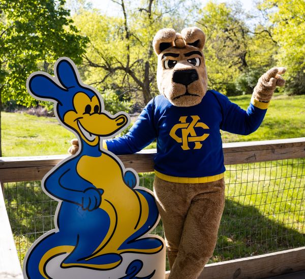 The KC Roo mascot poses with a cutout of the Classic Roo, drawn by Walt Disney