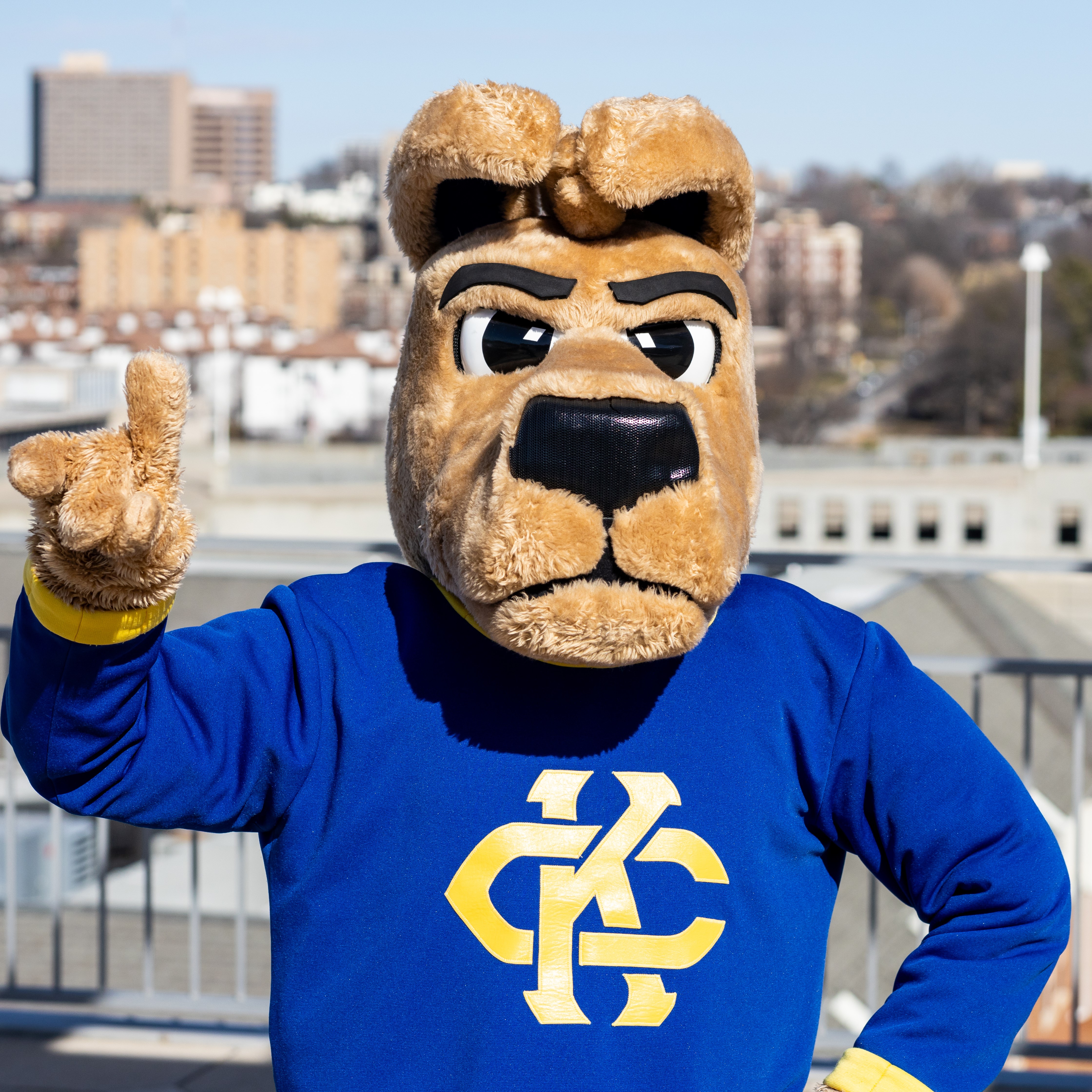 The athletic KC Roo mascot giving the Roo Up hand sign