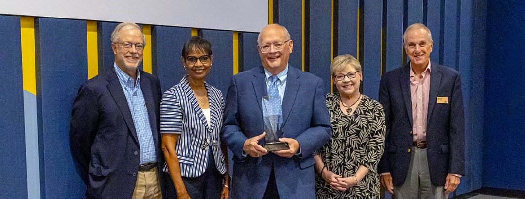 UMKC Trustees awarding a fellow trustee with the Bloch Excellence Award