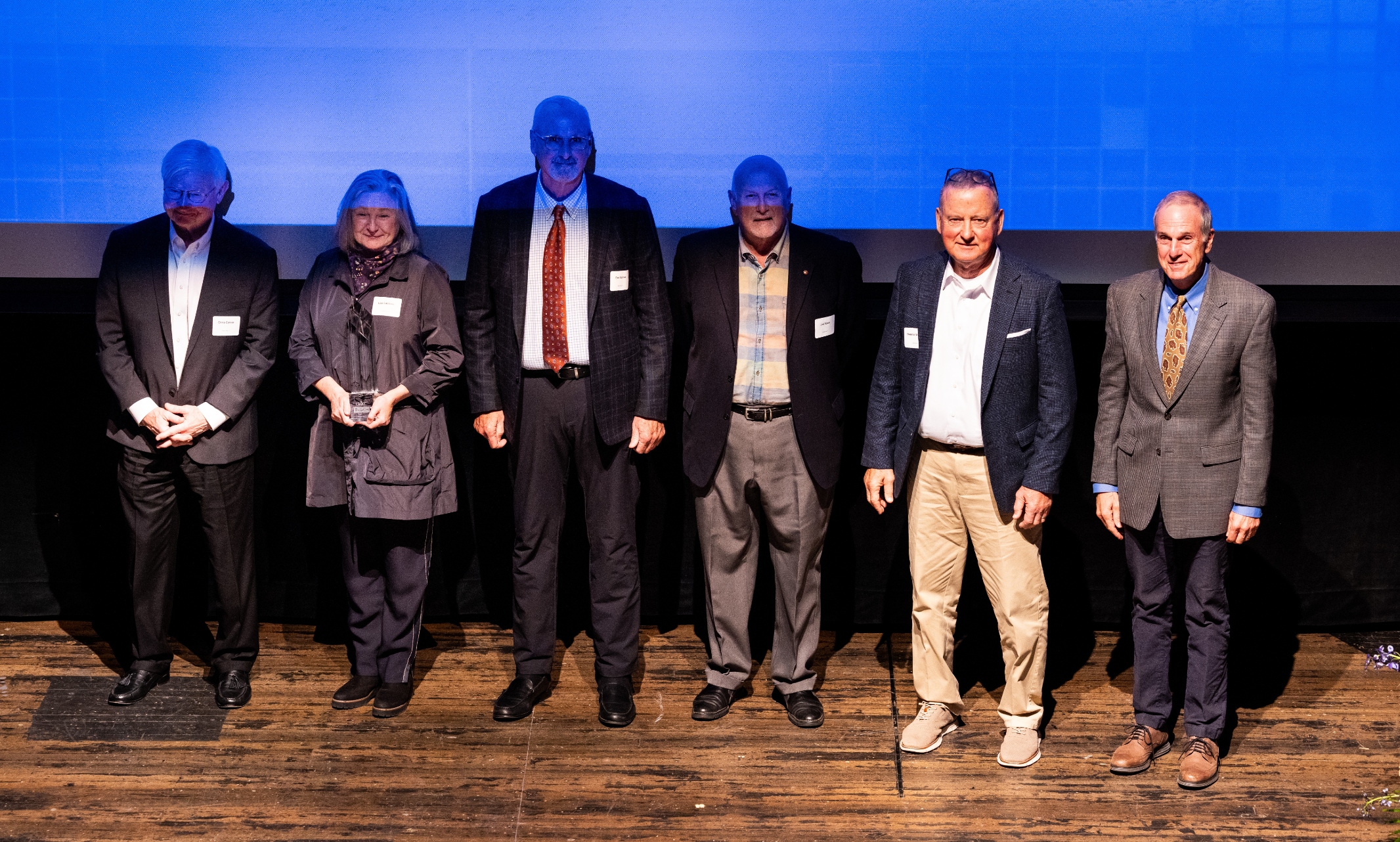 The founders of Populous pose with their awards