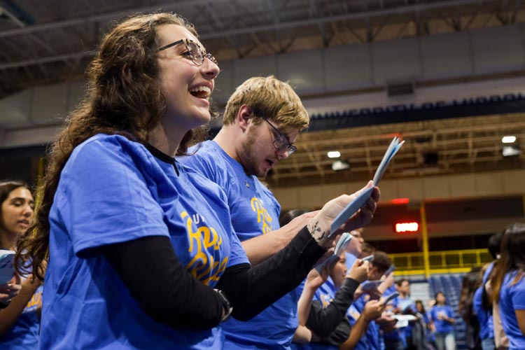 students sing the UMKC fight song for the first time