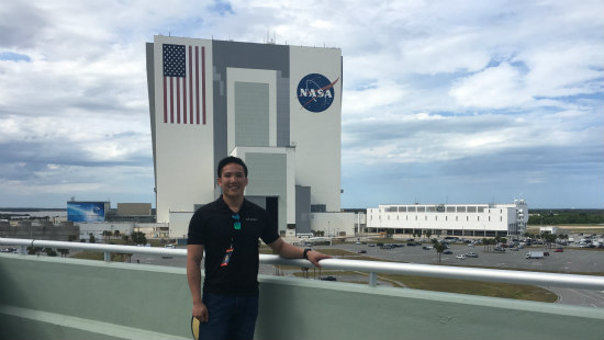Luan Ngo standing in front of NASA building