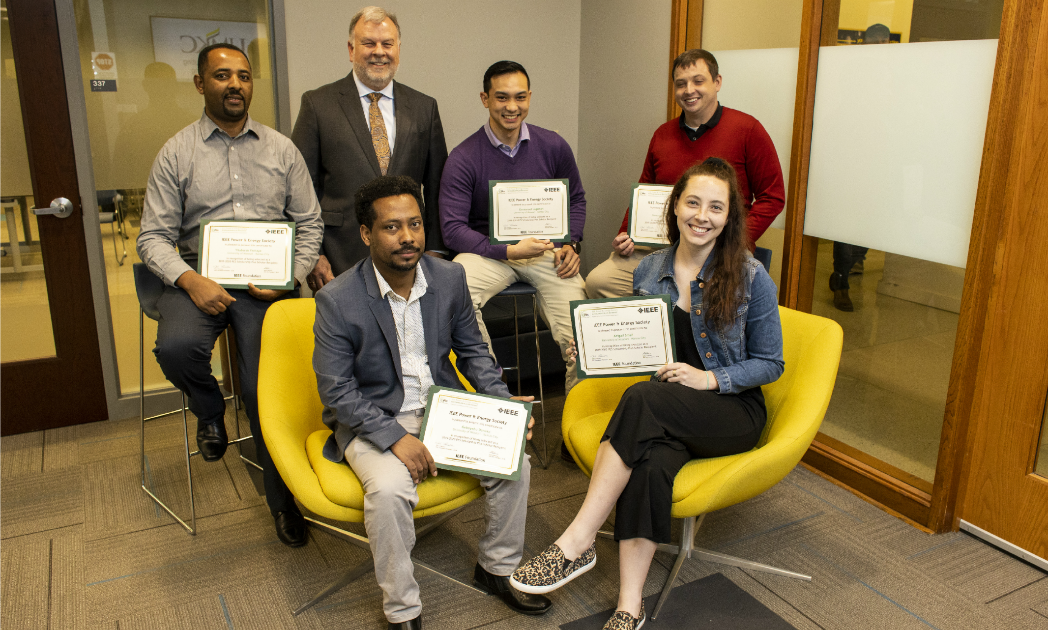 Five of eight IEEE-PES scholars pictured with School of Computing and Engineering Dean Kevin Truman 