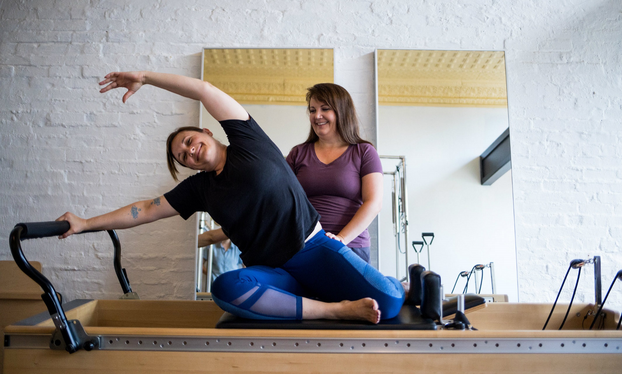 Lauren Thompson with client Sofia inside Thrive Pilates