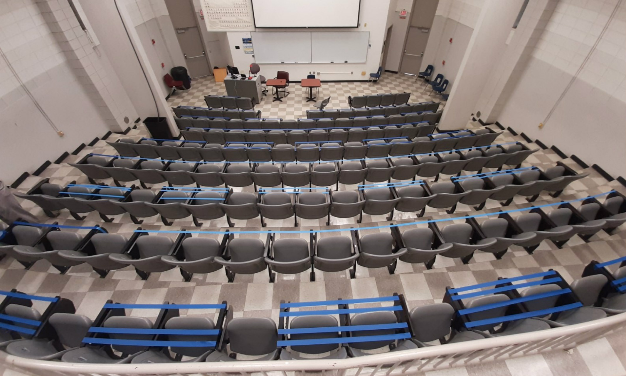 An auditorium in Royall Hall has taped off seating to allow for six feet of physical distancing.
