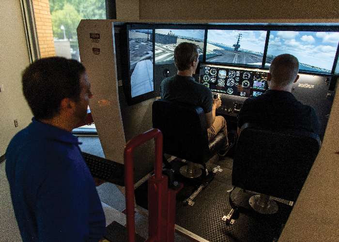students in flight simulator