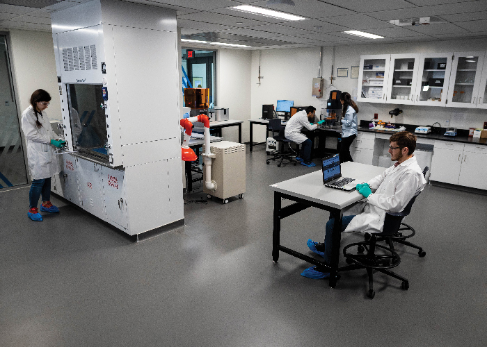 UMKC researchers work in a clean room.