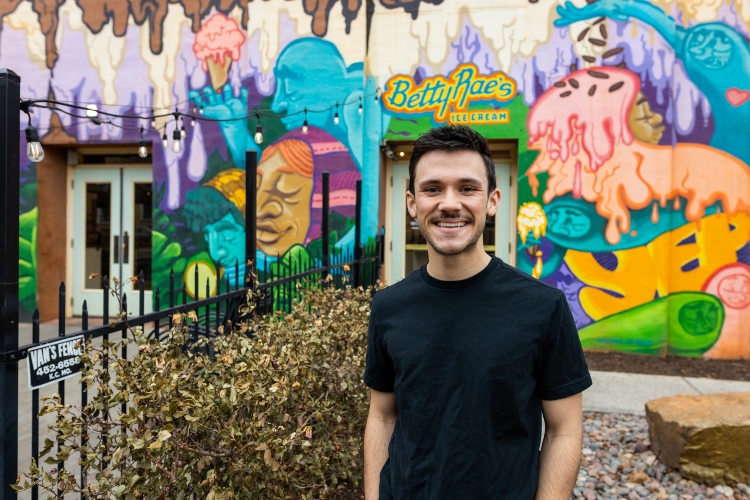 Alec Rodgers stands in front of Betty Rae's ice cream shop
