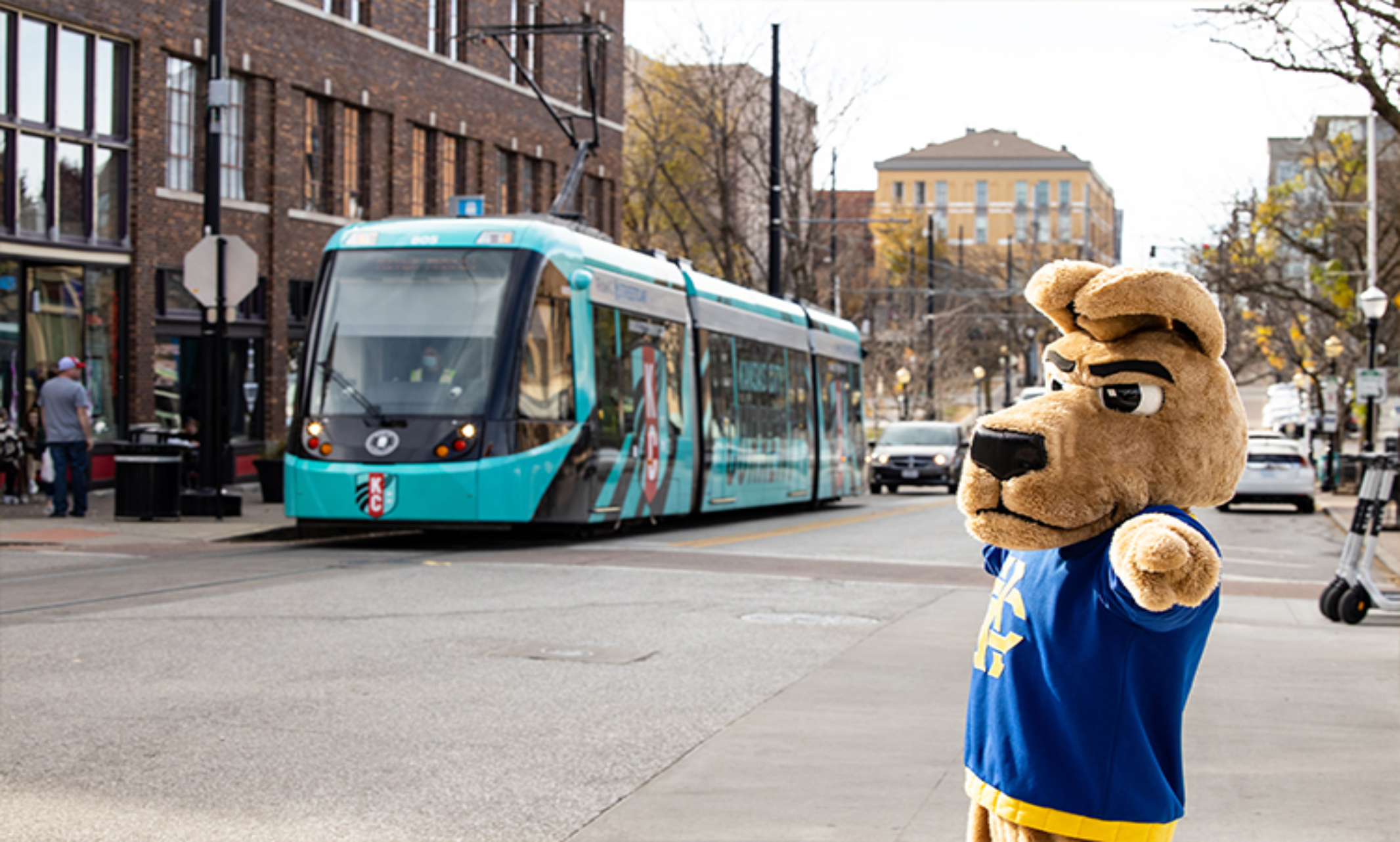 Kasey the Kangaroo poses in front of the KC Streetcar