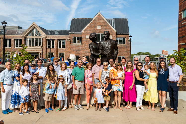 Entire Bloch family gathers in front of statue of Henry and Marion Bloch