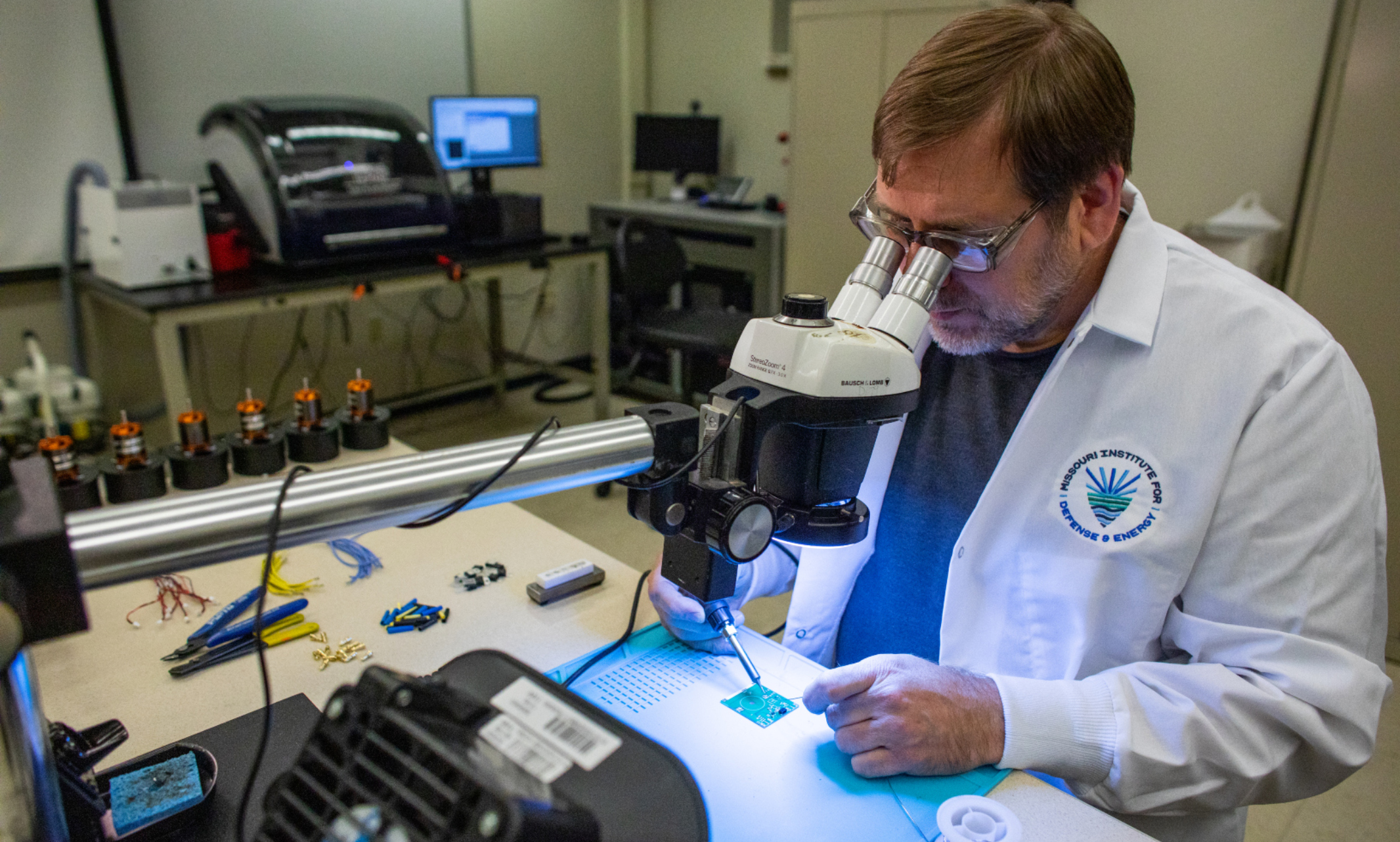 Scientist in UMKC lab working on microelectronic components