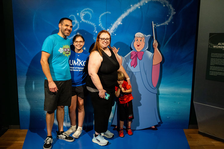 UMKC family at a photo op in the Disney 100 exhibit