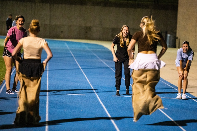 Students participate in a potato sack race at Durwood 