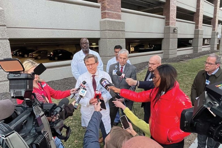 Dr. Mark Steele speaking to the media