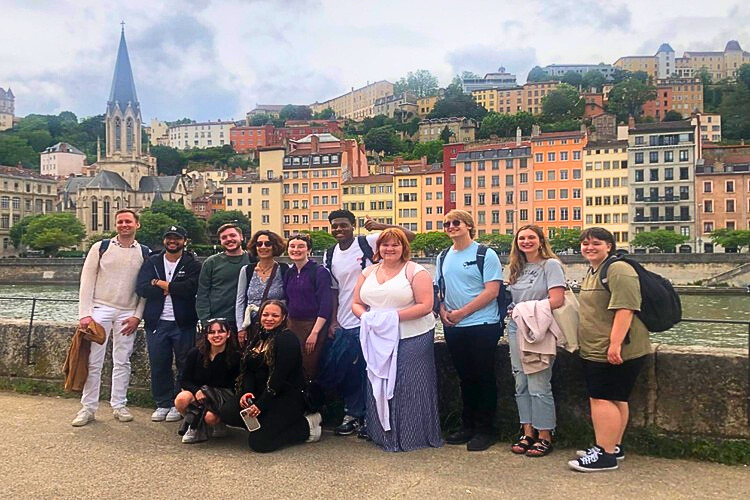 Hunter and other students from UMKC pose in front of the Saône River