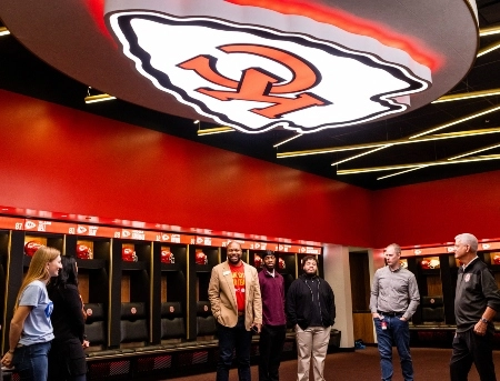 UMKC students listen to members of the Chiefs staff during a job shadowing and stadium tour day.