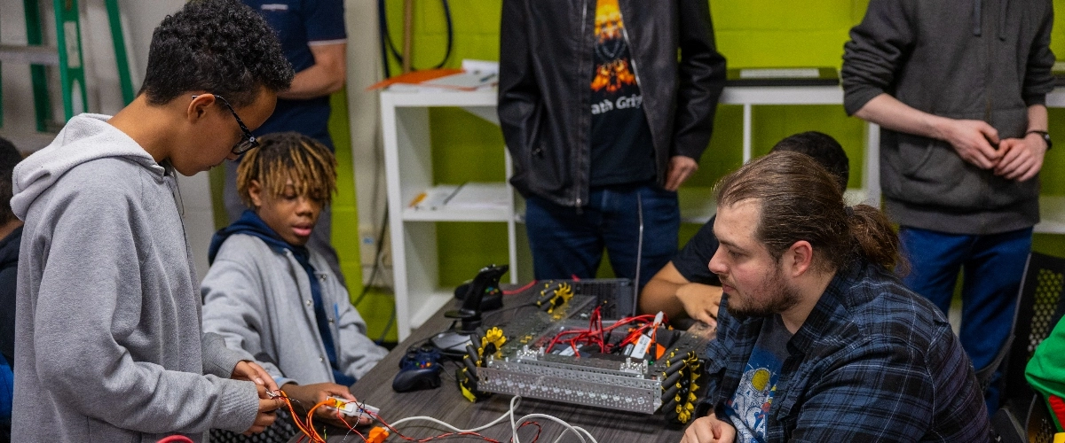 Youth work with mentors to build robot that will throw the first pitch at a Royals game