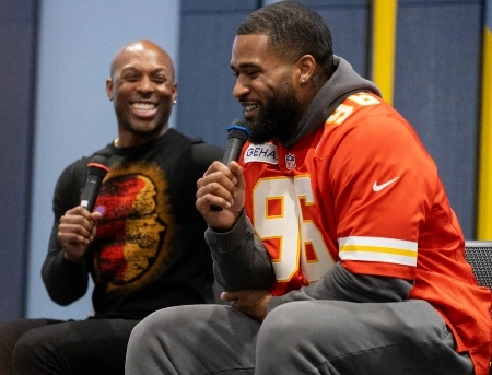 Guest speakers, Fabian Lovett and Ramzee Robinson speak to a group of people at UMKC.