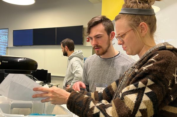 A Bloch student helps a community member prepare her taxes for filing.